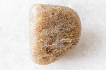 sample of polished cryolite rock on white