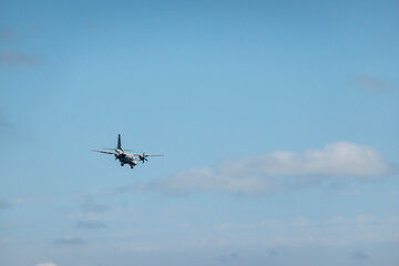 Military transport turboprop aircraft landing maneuver