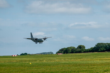 Military transport turboprop aircraft landing maneuver