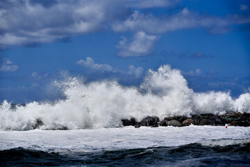 Waves crashing against rocks in Italy