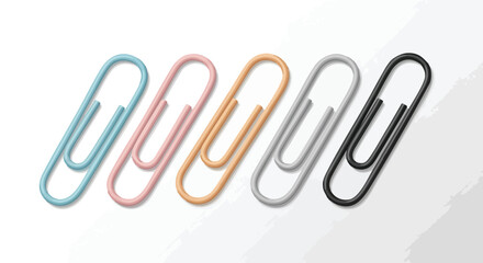 Colorful paper clips lined up on a white surface.