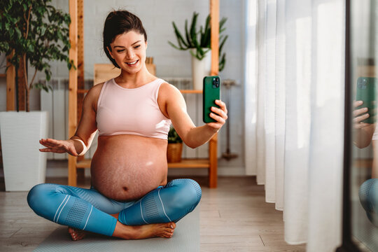 Live streaming, fitness and phone of pregnant woman exercise, pilates or workout on social media