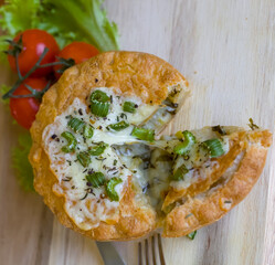 Top View of Leek, Potato and Cheddar Cheese Puff Pastry Pie with Cream and Butter, Tomatoes and Lettuce, British Food