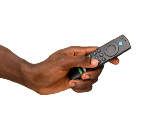 A hand holding a black remote control with multiple buttons, isolated on a transparent background.