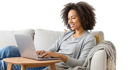 Happy black woman working from home or shopping online while sitting comfortably on a couch