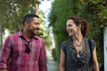 Fototapeta premium Business Collaboration Hispanic Man and Caucasian Woman Walking Together in Urban Environment Lifestyle Documentary Style