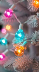 Close-up of a white Christmas tree adorned with colorful, glowing round lights, creating a festive atmosphere.