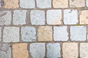 Weathered cobblestone pavement revealing historical wear, textured surface reflecting age old journey through urban landscape, capturing timeless architectural heritage of Brussels