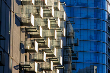 Glass balconies in multi-family buildings, apartment density, real estate, and housing market.