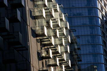Glass balconies in multi-family buildings, apartment density, real estate, and housing market.
