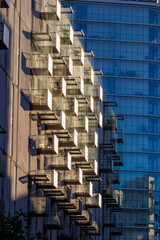 Glass balconies in multi-family buildings, apartment density, real estate, and housing market.