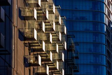 Glass balconies in multi-family buildings, apartment density, real estate, and housing market.