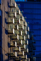 Glass balconies in multi-family buildings, apartment density, real estate, and housing market.