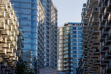 Glass balconies in multi-family buildings, apartment density, real estate, and housing market.