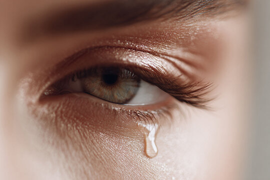 Closeup of a crying eye. Evokes themes of sadness, grief, emotion, and vulnerability. Ideal for editorials, mental health campaigns, and emotive storytelling.