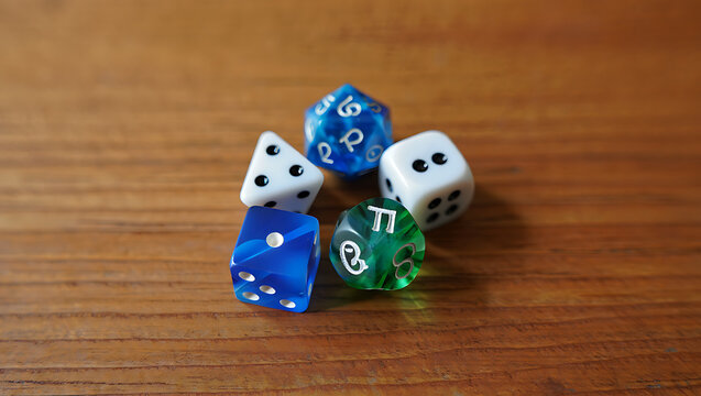 A collection of assorted dice for tabletop role playing games arranged on a wooden surface with various numbers and symbols visible