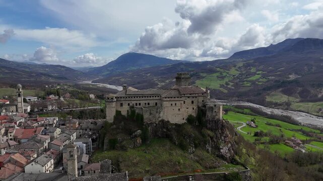 Bardi Castle dominating the landscape in Emilia Romagna, Italy, aerial panoramic view
