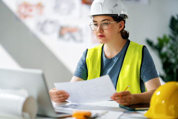Woman architect is working on plans