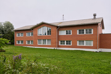 A Contemporary Brick Building Set in a Peaceful and Tranquil Landscape Environment