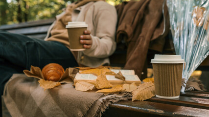 Autumn picnic with coffee and a book