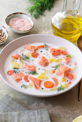 Finnish fish soup lohikeitto with salmon and vegetables. National cuisine. Healthy eating.