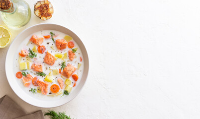 Finnish fish soup lohikeitto with salmon and vegetables. National cuisine. Healthy eating.