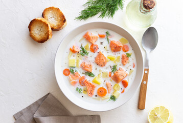 Finnish fish soup lohikeitto with salmon and vegetables. National cuisine. Healthy eating.