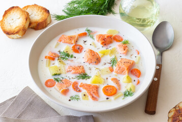 Finnish fish soup lohikeitto with salmon and vegetables. National cuisine. Healthy eating.