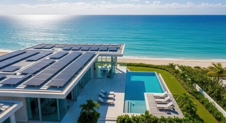 Fototapeta premium Beachfront modern house with solar panels and pool under blue sky
