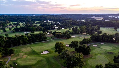 Aerial view of a golf course at sunset