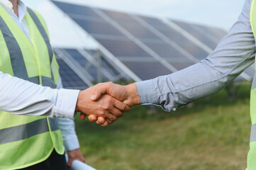 Business partnership handshake for renewable solar energy agreement
