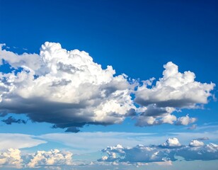 Cumulus clouds against a vibrant blue sky