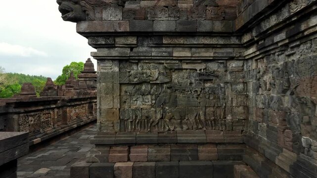 Walking around the Buddist temple Borobudur near Yogyakarta city, Central Java, Indonesia. World famous landmark in Indonesia