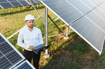 Engineer working on solar panel power plant