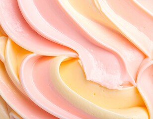 Close-up swirls of pastel pink and yellow creamy texture