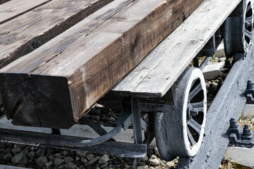 The image shows a truck on rails used to transport timber