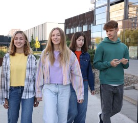 Obraz premium Group of teenagers walking on city street