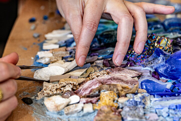 Mosaic artisan at work – creation of glass and stone mosaics