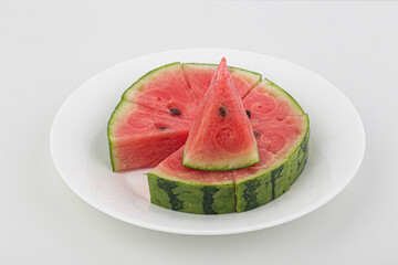 Slice of watermelon isolated on white background .