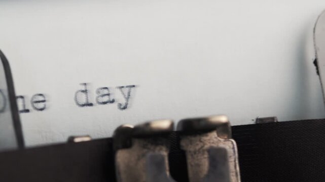 Inscription one day at a time on vintage typewriter