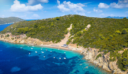 Fototapeta premium Aerial view of Arkos Beach and island next to the town of Skiathos, Sporades, Greece