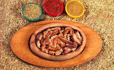 a beautiful picture of kokorech served with vegetables and spices