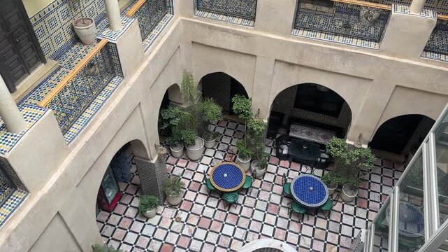 Interior of Moroccan riad hotel courtyard traditional architecture Morocco North Africa
