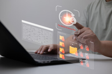 Ransomware encryption attack concept with locked file icons, binary code, and bitcoin payment request, showing user interacting with screen under cyberattack and digital extortion scenario.