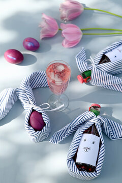 Rhubarb juice and Easter decorations with tulips in garden