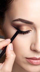 Close-up of makeup application on a woman's face