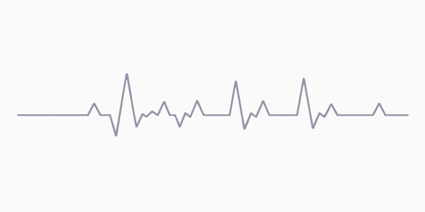 Green EKG wave graph showing a heartbeat rhythm on a monitor screen for medical health care in a hospital