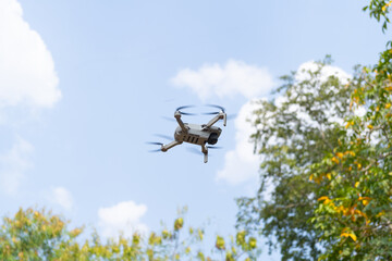 A lightweight video quadcopter drone flying in the sky 