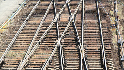 The picture depicts rails along which trains depart into the unexplored