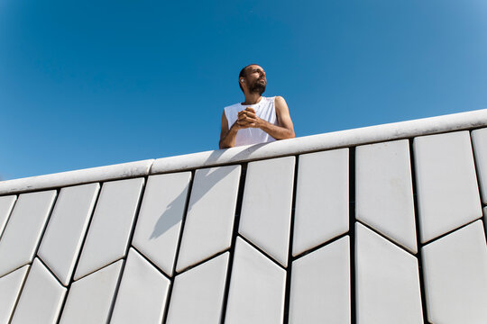 Man in sportswear resting after morning run at MAAT Lisbon